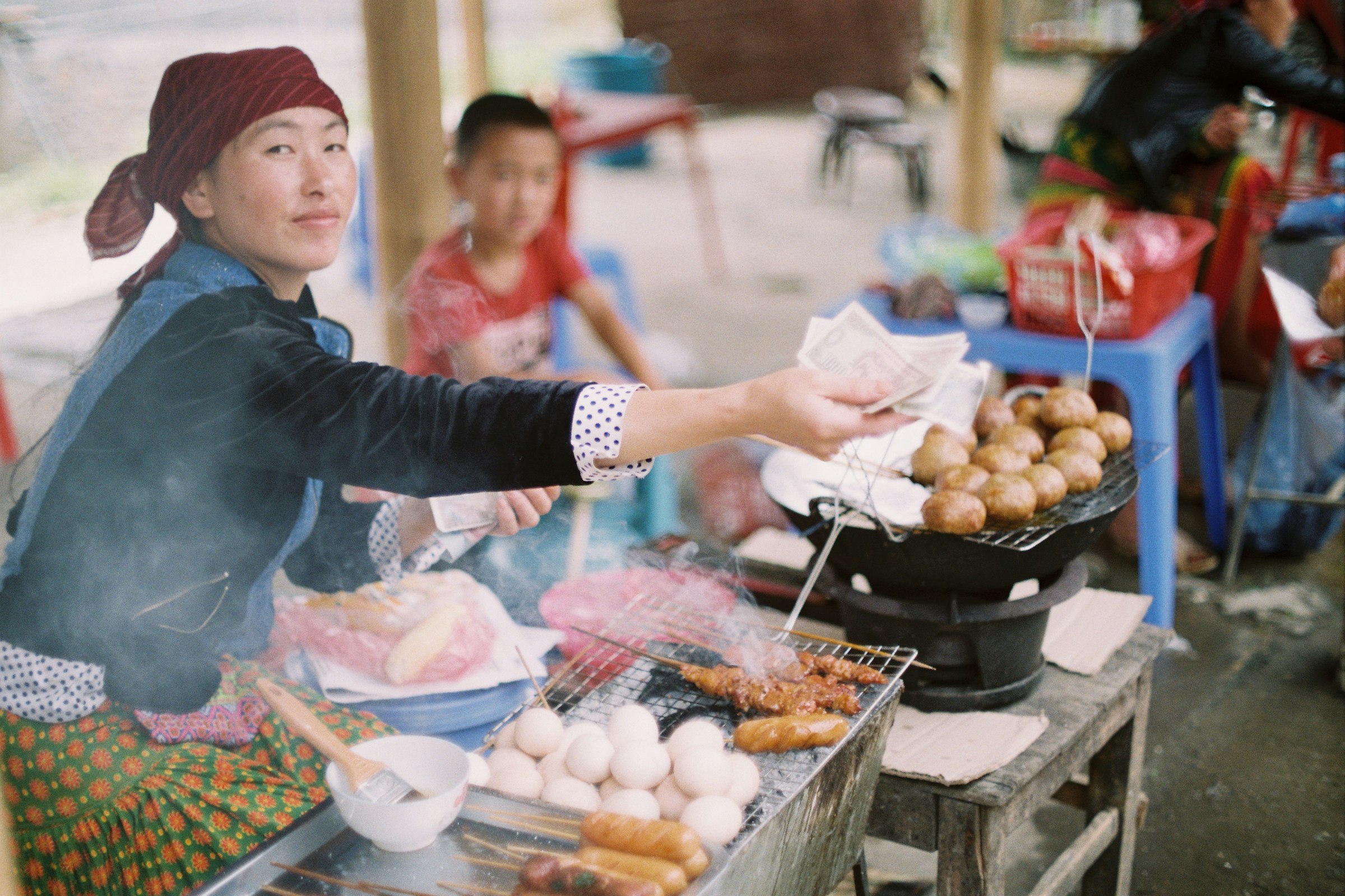 Charcoal-grilled bun cha served with fresh herbs in Hanoi