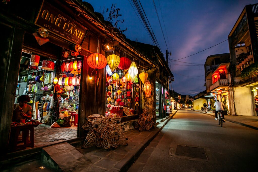 Ochre-walled merchant houses along a quiet Hoi An lane