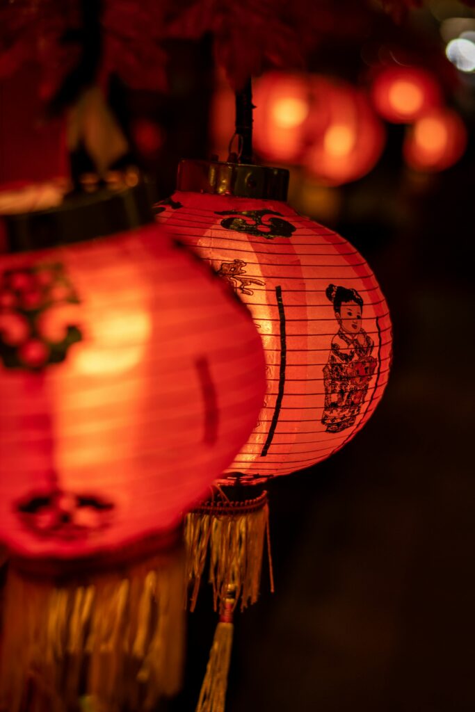 Silk lanterns strung across a lantern-lit street in Hoi An old town