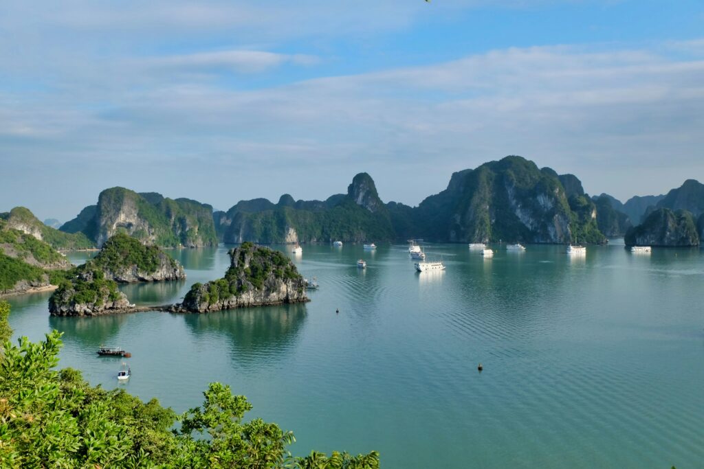 Mist over the limestone peaks of Halong Bay at dawn