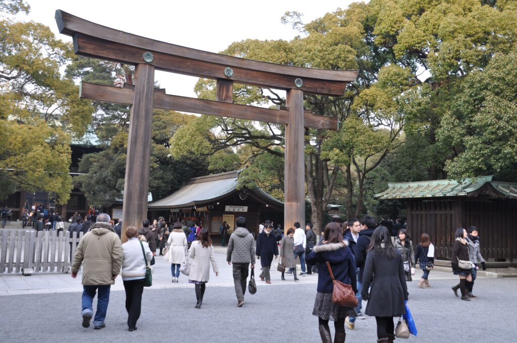 Entrance to Meiji Jingu shrine beneath autumn trees in Tokyo