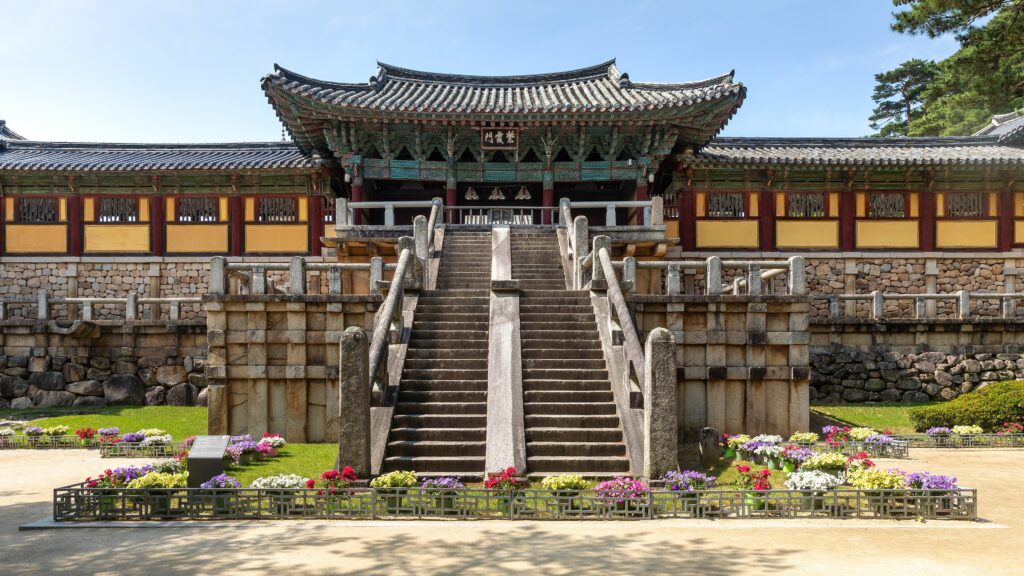 3840px-Bulguksa temple entrance gate stairs flower bed and blue sky in Gyeongju South Korea