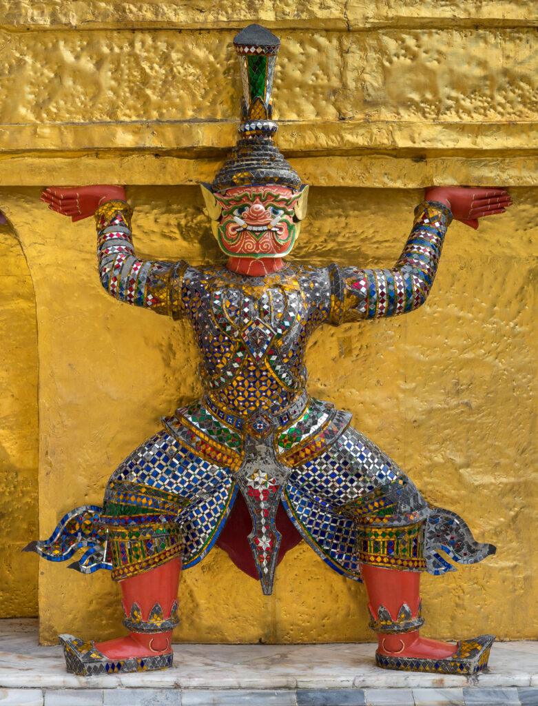 Statue of Yaksha supporting one of the Two Golden Chedi of Wat Phra Kaew, Bangkok, Thailand