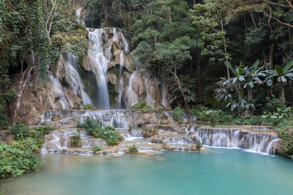 Turquoise plunge pool beneath Kuang Si falls
