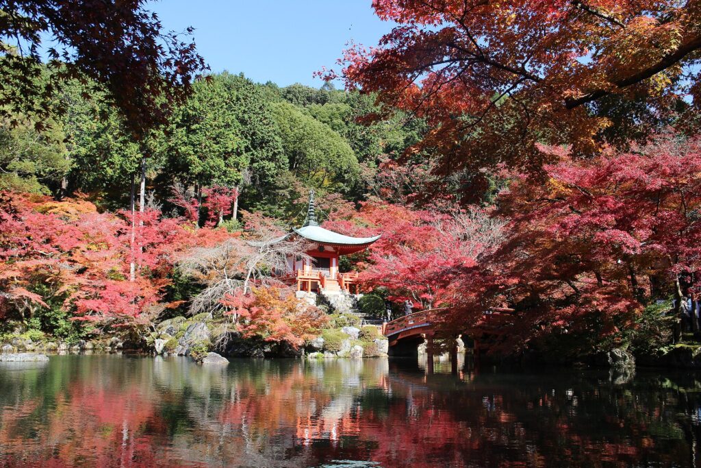 Benten-do temple surrounded by red autumn leaves at Daigoji in Kyoto
